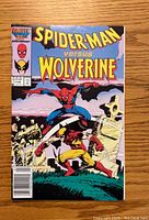 Front cover of Spider-Man Versus Wolverine #1 comic book showing Spider-Man and Wolverine fighting, with Marvel 25th Anniversary logo and comic issue details.
