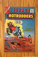Front cover of Teenage Hotrodders #2 comic book showing a dragster car and driver with bright colors and vintage style artwork.