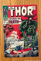 Front cover of The Mighty Thor #150 comic showing Thor, a ship, and a villainous character in green armor.