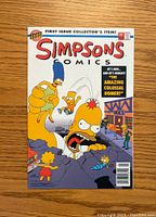 Front cover of The Simpsons Comics #1 comic book featuring the main Simpsons characters in a dramatic scene.