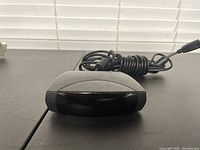 Top view photo of the Dell IR receiver showing the front tinted infrared sensor surface and attached USB cable.