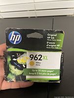 Front of HP 962XL yellow ink cartridge box showing brand, model, color, and key details like up to 2X more pages.