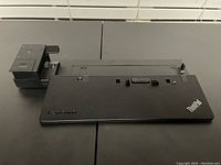 Top view of the Lenovo ThinkPad Ultra Dock docking station showing logos, docking connectors, and ports.