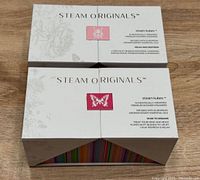 Two boxed sets of Steam Originals shower steamers labeled Serenity Relax and Dusk to Dreams.