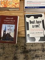 Two spiral bound cookbooks: 'Shawville United Church 175th Anniversary Collection of Recipes' and 'Don't Have a Cow! How to Thrive in a Post-Cow World'