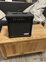 Front view of Crate GX-25R amplifier on wooden table.