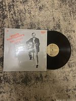 Front cover of the vinyl record showing Roger Whittaker sitting with guitar and album title in red text