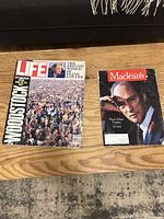 Both magazines laid out on floor: LIFE Woodstock cover and Maclean's with Elliot Trudeau cover