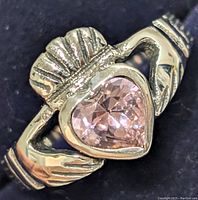 Close-up of the front of the silver Claddagh ring showing the heart-shaped cubic zirconia and hands design with crown.