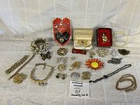 Group overview of entire jewelry lot laid out on cloth