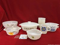 All 16 milk glass pieces arranged together