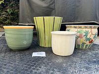 Front view of four ceramic planters