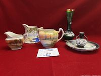 front view of all six Japanese porcelain pieces