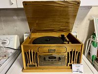 Lid open showing turntable platter, tonearm and interior