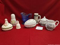 Group shot of all eight Avon collectible pieces