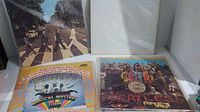 Image showing Abbey Road album vinyl record cover on left and Magical Mystery Tour album on right