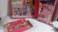 Overview of three Barbie playsets with packaging including Play Pak Horseback Riding, Western Fun Sun Runner Horse, and Cooking Center