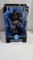 Front view of the boxed Batman Arkham Knight action figure from DC Multiverse series by McFarlane Toys.