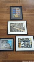 Four framed photographic prints laid out on wooden floor showing window reflection scenes, two signed by artist