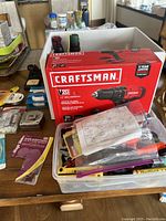 Craftsman cordless drill with box, mixed small hardware items in containers