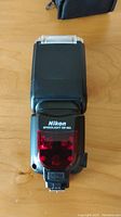 Top view of Nikon Speedlight SB-900 flash front showing model markings and sensor panel.
