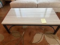 Front view showing entire stone top and metal base