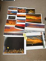 All prints laid out showing various sunset and sky scenes in assorted sizes