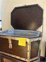 Open Taster's Cellaret showing metal-lined interior and riveted leather exterior.