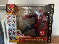 Front view of the Amazing Spider-Man figure in original packaging showing figure, branding and articulation points label.