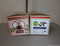 Photo of two DIY felt animal kits by Cate & Levi, showing fronts of the boxes with images of a raccoon and a llama.