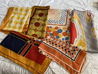 Overview of all six scarves showing their distinct color patterns and prints
