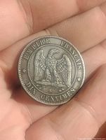 Reverse view showing perched eagle with wings spread, surrounded by stars and inscriptions indicating denomination and empire.