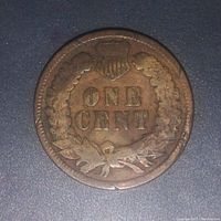 Reverse side of 1891 Indian Head Cent showing the denomination 'ONE CENT' surrounded by a wreath and shield.