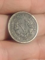 Reverse side of the 1907 Liberty Head V nickel showing large 'V' and wreath with inscriptions.