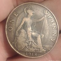 Reverse side of 1918 English penny featuring Britannia holding a trident and shield with 'ONE PENNY' and date.
