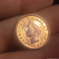 Obverse side showing profile of King George VI and inscriptions
