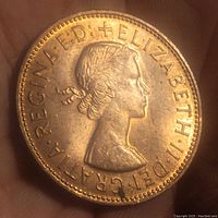 Front side of the 1967 English penny showing Queen Elizabeth II portrait and inscription.
