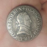 Obverse side showing the profile portrait of Henri III with inscription around and date 1577 below the bust