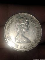 Obverse of the coin showing Queen Elizabeth II's portrait with the years 1952-1977 and name inscription