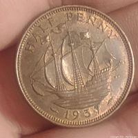 Obverse side of the 1937 English half penny coin showing detailed sailing ship design with 'HALF PENNY' and date '1937'.
