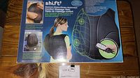 Box of Electronic Shiatsu Comfort Massage Vest showing product features and brand name Shift?