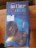 Boxed Obus Forme Back and Seat Cushion Massager with Heat, showing front side of the packaging detailing product features and images.