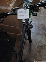 Handlebar view showing Lot number tag and bike frame top tube.