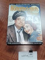 Front of DVD set box titled 'The Honeymooners Lost Episodes 1951-1957 60th Anniversary Edition' featuring a man in police uniform and a woman on the cover.