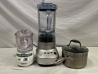 Photo shows the full lot including Cuisinart Mini-Prep Plus chopper and Breville blender with Scanpan saucepan to the right.