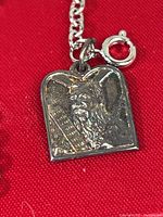 Front of pendant showing Moses holding the tablets of the 10 Commandments