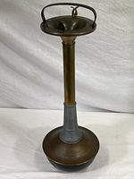 Full view of the vintage standing ashtray showing height and base design