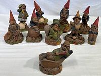 Full collection of 10 Tom Clark gnome figurines arranged in rows showing various sports poses.