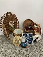 Full lot showing all assorted decorative housewares arranged on carpet.