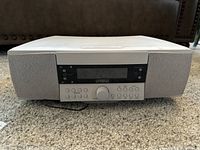 Front view of the Cambridge SoundWorks Radio 730 system showing integrated speakers, control panel, and display.